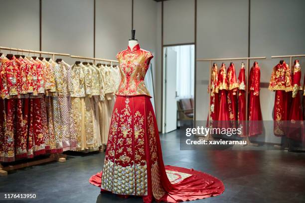 chinese wedding dress showroom featuring qun gua and train - chinese model stock pictures, royalty-free photos & images