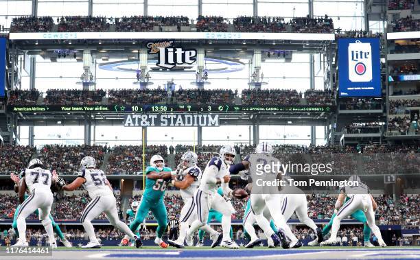 Dak Prescott of the Dallas Cowboys hands the ball off to Ezekiel Elliott of the Dallas Cowboys in action against the Miami Dolphins in the first half...