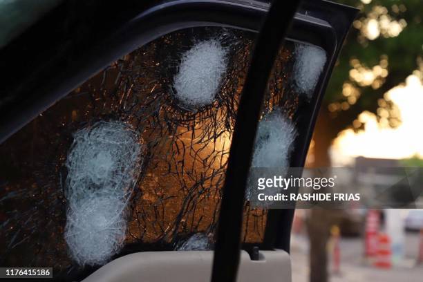 View of the bullet ridden window of a vehicle in a street of Culiacan, state of Sinaloa, Mexico, on October 17, 2019. Heavily armed gunmen in...