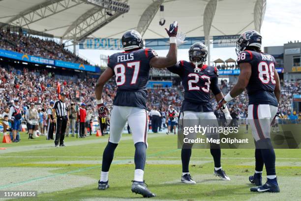 Tight end Darren Fells of the Houston Texans celebrates his touchdown in the second quarter against the Los Angeles Chargers with running back Carlos...