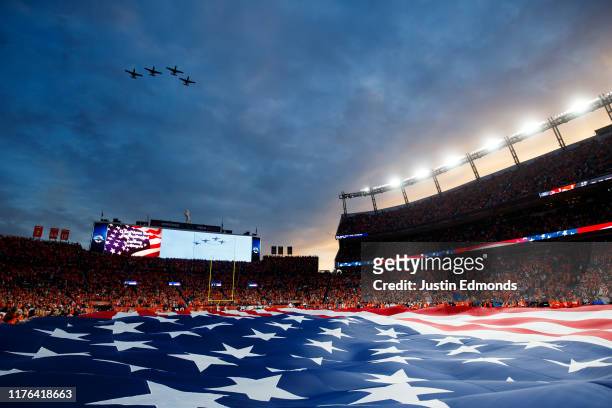 General view of the stadium as planes fly over during the National Anthem before a game between the Kansas City Chiefs and Denver Broncos at Empower...