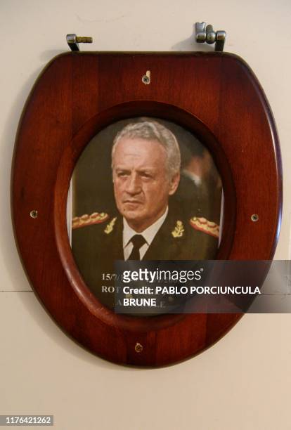 Portrait of Argentine dictator Leopoldo Galtieri is seen at the Victory Pub's bathroom in Stanley, Falkland Islands on October 08, 2019. - Argentina...