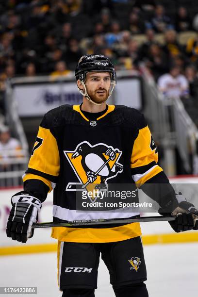 Pittsburgh Penguins Left Wing Adam Johnson looks on during the second period in the NHL game between the Pittsburgh Penguins and the Colorado...