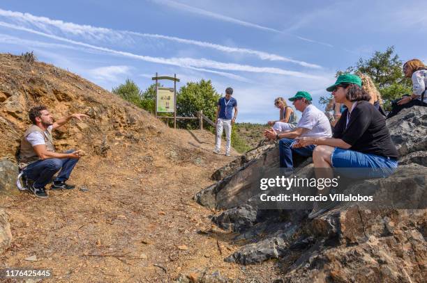 Geologist Pedro Peixoto briefs participants on geosite G32, at the top of the slope over the Sabor River, where rocks show on the surface what...