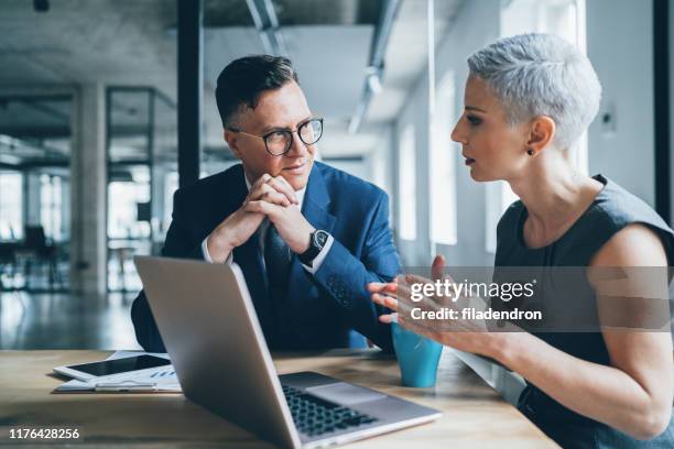 business coworkers - man talking stock pictures, royalty-free photos & images