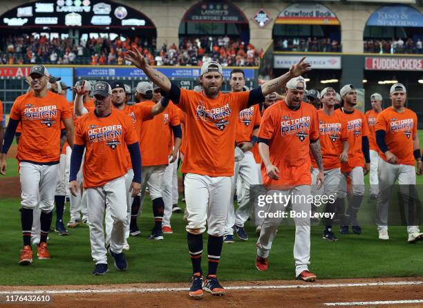 Josh Reddick of the Houston Astros and the team acknowledges the crowd after winning the American League West Division after defeating the Los...