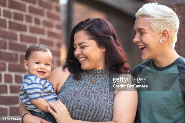 lgbt+ family with baby - androgynous boys stock pictures, royalty-free photos & images