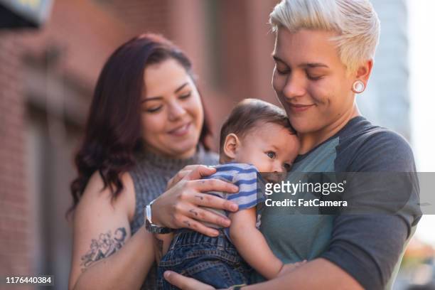 lgbt+ family with baby - fat lesbian stock pictures, royalty-free photos & images