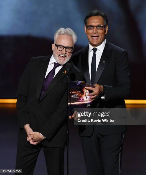 Bradley Whitford and Jimmy Smits speak onstage during the 71st Emmy Awards at Microsoft Theater on September 22, 2019 in Los Angeles, California.