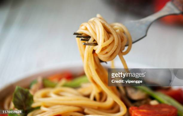 homemade sausage and tomato spaghetti - fork stock pictures, royalty-free photos & images