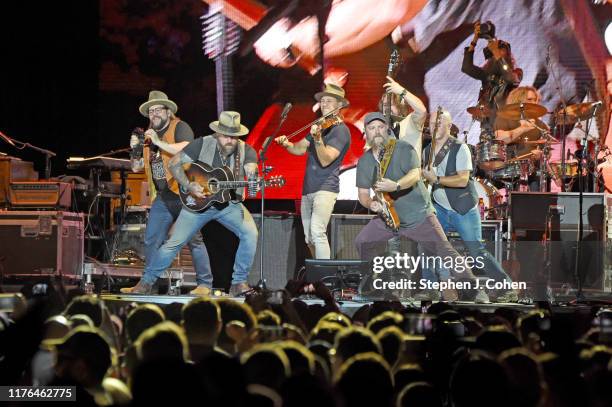 Coy Bowles, Zac Brown, Jimmy De Martini, Clay Cook, Matt Mangano ,Daniel De Los Reyes, and Chris Fryar of the Zac Brown Band performs during the 2019...