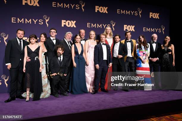 Cast and crew of 'Game of Thrones' pose with awards for Outstanding Drama Series in the press room during the 71st Emmy Awards at Microsoft Theater...