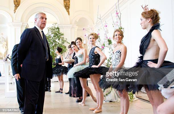 Prince Andrew, Duke of York is introduced to ballerinas by Managing Director Craig Hassall at the English National Ballet's summer party at The...