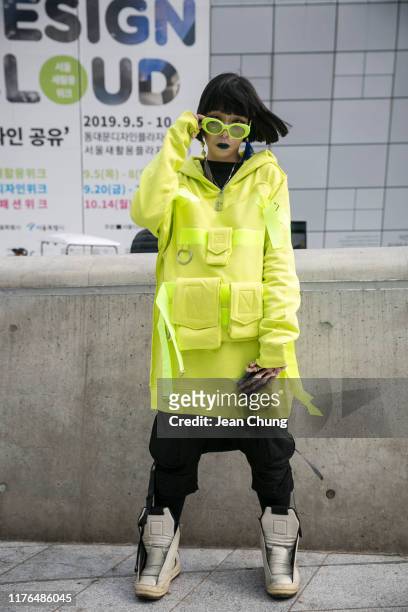 Guest wearing Rick Owens hightop sneakers is seen during the Seoul Fashion Week 2020 S/S at Dongdaemun Design Plaza on October 18, 2019 in Seoul,...