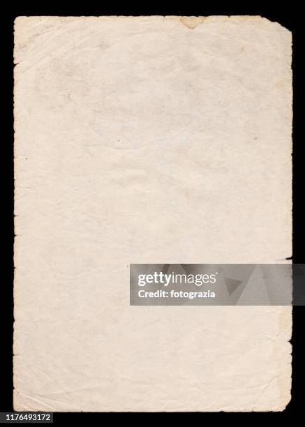 old paper on black background - faded condition stock-fotos und bilder