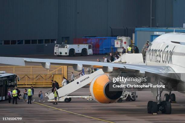 Passengers disembark a Thomas Cook aircraft at Manchester Airport on September 23, 2019 in Manchester, United Kingdom. The collapse of the...