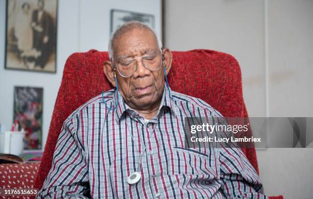 91 year old man taking a nap in his chair - old man and glasses ストックフォトと画像