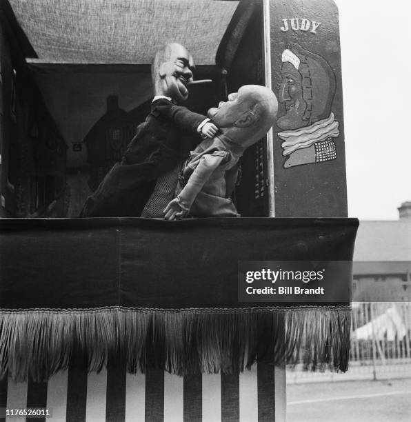 British Prime Minister Winston Churchill and Italian dictator Benito Mussolini in puppeteer Tom Haffenden's topical wartime Punch and Judy puppet...