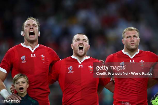 Alun Wyn Jones, Ken Owens and Ross Moriarty of Wales sing the national anthem prior to the Rugby World Cup 2019 Group D game between Wales and...