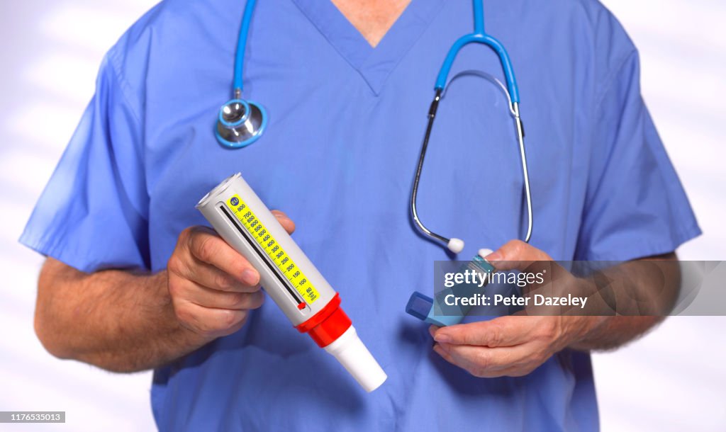 Bechomometer Inhaler Doctor Holding Peak Flow Meter And Asthma Inhaler High-Res Stock Photo ...