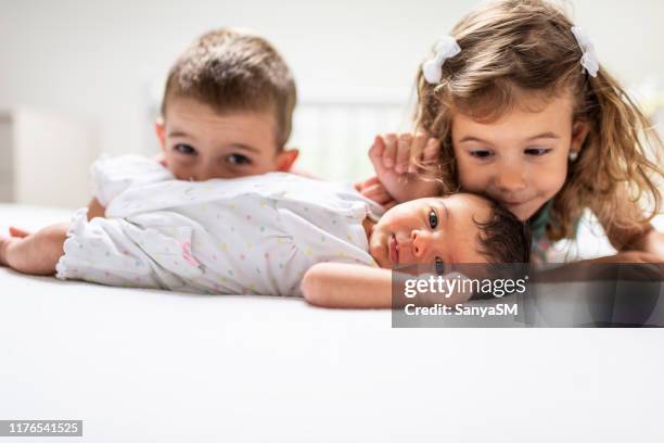 our happy childhood - siblings baby stock pictures, royalty-free photos & images