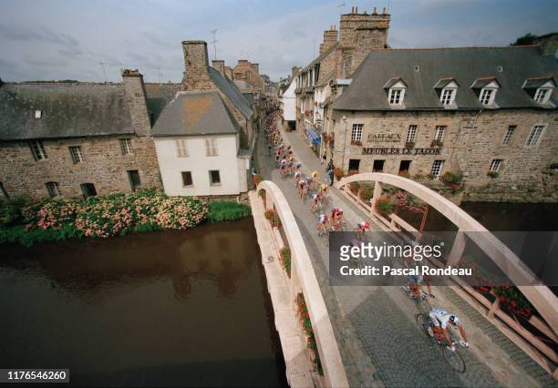The peloton rides across the bridge at Pontrieux during stage two of the Tour de France from Perros-Guirec to Vitre on 3rd July 1995 near Bouchain,...