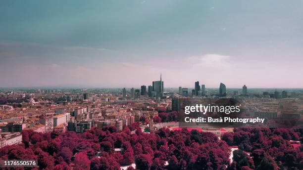 color manipulation of view of the porta nuova downtown district from parco sempion. milan, italy - milano porta nuova foto e immagini stock