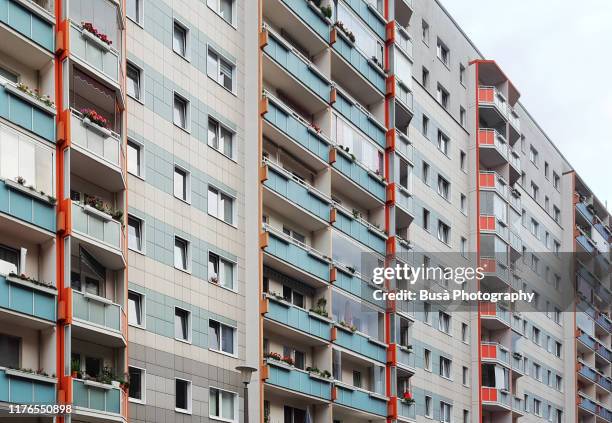 facade of prefabricated housing (plattenbau) in east berlin, germany - berlin modernism housing estates stock pictures, royalty-free photos & images
