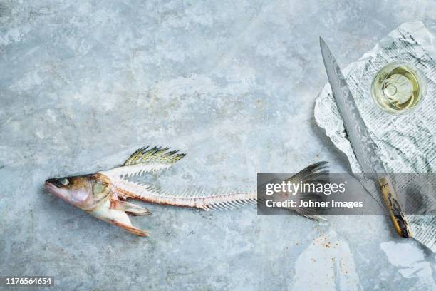knife and fishbones - covered food with wine stock pictures, royalty-free photos & images