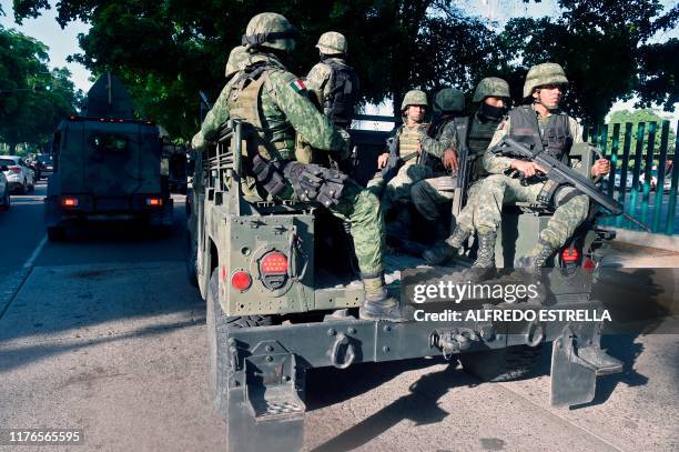 Soldiers patrol the surroundings of the government palace in Culiacan, Sinaloa state, Mexico, on October 18, 2019. - Mexico's president faced a...