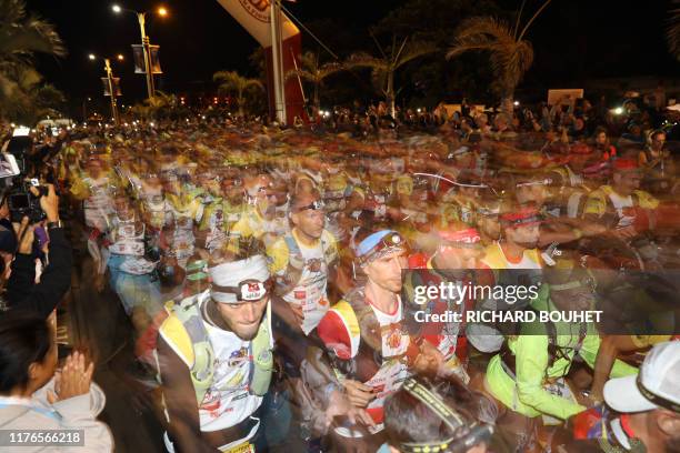 Runners take the start of the Grand Raid de la Reunion ultramarathon race on October 17, 2019 in Saint-Pierre de la Réunion on the French Indian...