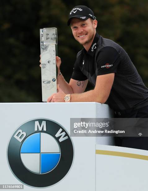 Danny Willett of England poses with the trophy after winning the BMW PGA Championship at Wentworth Club on September 22, 2019 in Virginia Water,...