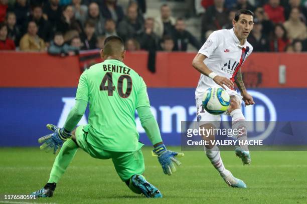 Paris Saint-Germain's Argentine midfielder Angel Di Maria shoots and scores a goal against Nice's Argentine goalkeeper Walter Benitez during the...