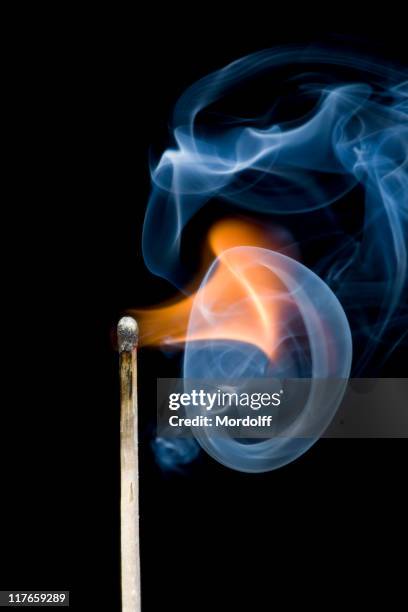 igniting match with smoke - match flame stock pictures, royalty-free photos & images