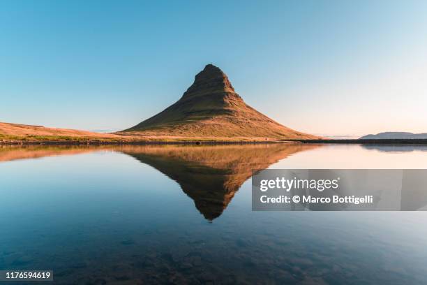 mount kirkjufell reflecting in lake, iceland - symmetry nature bildbanksfoton och bilder