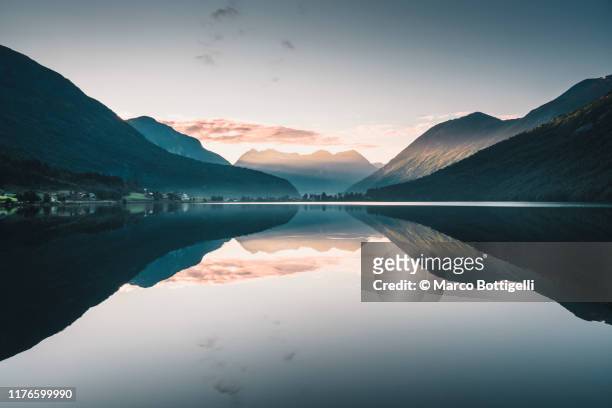 western norwegian fjord at sunrise , norway - traditionally norwegian stock-fotos und bilder