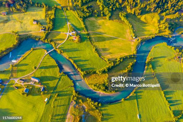 aerial view of river bending through meadows, norway - river aerial stock pictures, royalty-free photos & images