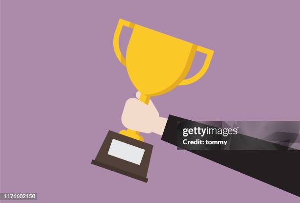 ilustraciones, imágenes clip art, dibujos animados e iconos de stock de empresario sostenemos trofeo - trophy