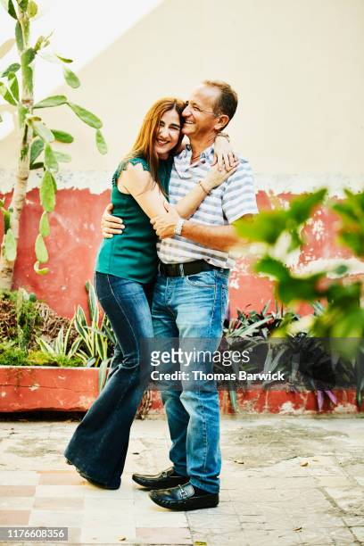 Portrait of laughing embracing mature couple