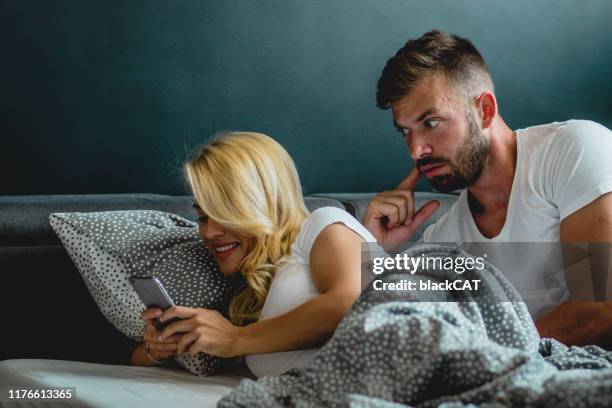 young couple is having relationship problems - cheating husband stock pictures, royalty-free photos & images