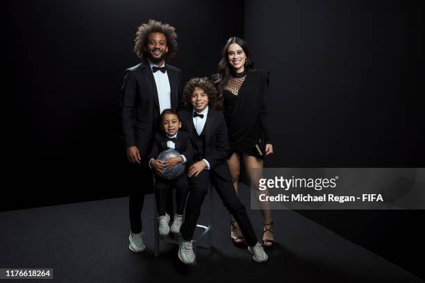 The FIFA FIFPro Men's World11 Award finalist Marcelo of Real Madrid and Brazil poses for a portrait with his wife Clarice Alves and their sons Enzo...