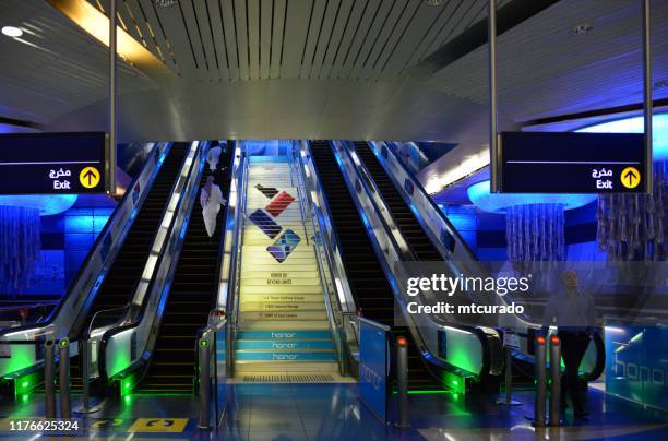 dubai metro, escalators at al fahidi station bur dubai, united arab emirates - dubai metro stock pictures, royalty-free photos & images