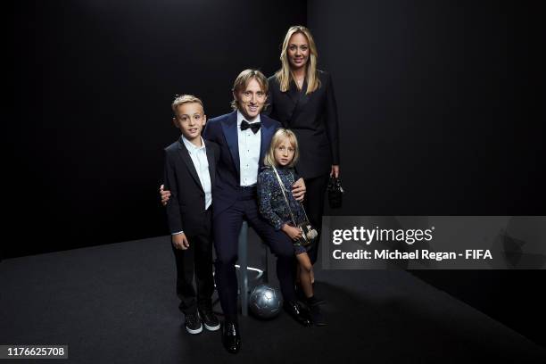 The FIFA FIFPro Men's World11 Award finalist Luka Modric of Real Madrid and Croatia, his wife Vanja Bosnic and their children Ivano and Ema poses for...