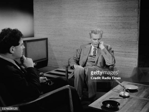 Author Aldous Huxley interviewed by presenter John Morgan for the BBC television series 'Panorama', July 1961.