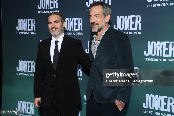 Joaquin Phoenix and Todd Phillips attend the "Joker" Premiere at cinema UGC Normandie son September 23, 2019 in Paris, France.