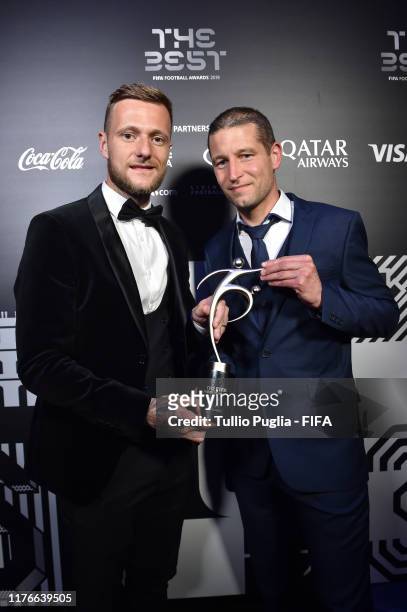 Liam Cooper, captain of Leeds United FC and fitness coach Benoit Delaval receive the FIFA Fair Play Award on behalf of Marcelo Bielsa, head coach of...