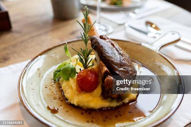 delicious braised lamb shank - roast lamb stock pictures, royalty-free photos & images