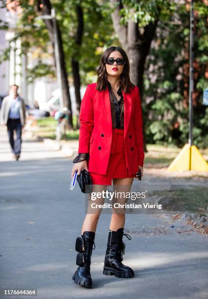 Paola Alberdi is seen wearing red blazer, assymetric skirt outside the Philosophy show during Milan Fashion Week Spring/Summer 2020 on September 21,...