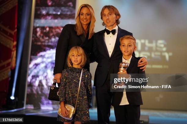 The FIFA FIFPro Men's World11 Award Winner Luka Modric of Real Madrid and Croatia, his wife Vanja Bosnic and their children Ivano and Ema poses for a...