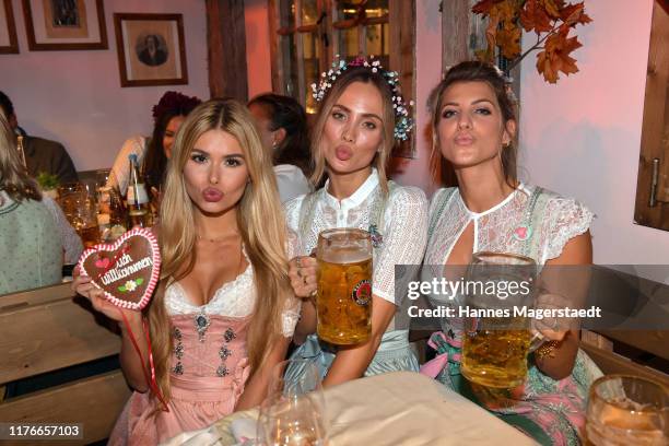 Pamela Reif, Carmen Kroll and Sarah Harrison during the Oktoberfest 2019 at Theresienwiese on September 23, 2019 in Munich, Germany.